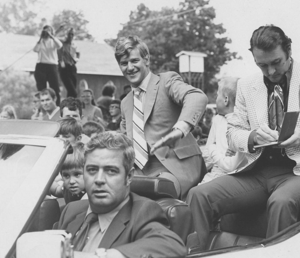 Bobby Orr riding in the back of a convertible in a parade in his honour in Parry Sound.