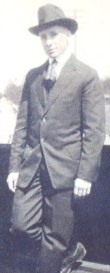 Bill Carson in a suit and hat.