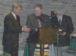 Bobby Orr presenting Bill Carson's induction award.