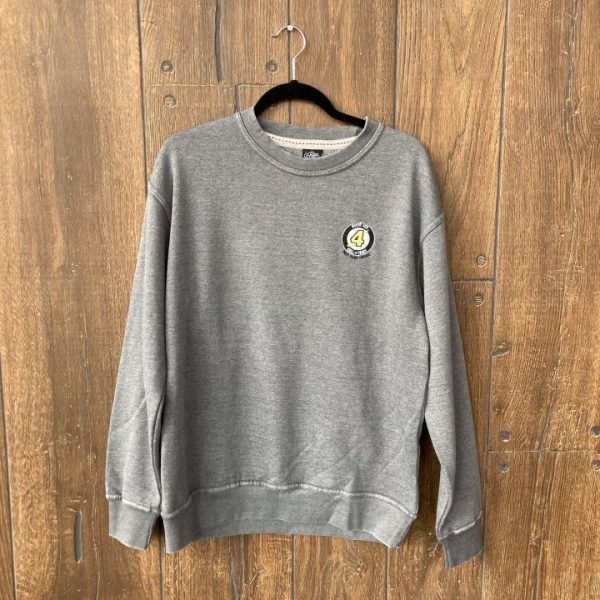 A grey crew neck sweatshirt hanging in front of a wood background. Sweatshirt has an embroidered Bobby Orr Hall of Fame logo on the left chest.