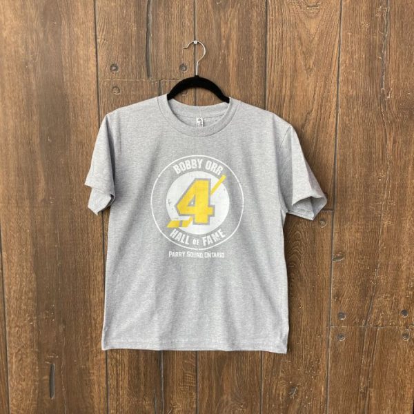 Grey youth t-shirt featuring a screen-printed Bobby Orr Hall of Fame logo (hockey puck and stick with the number 4 and words saying Bobby Orr Hall of Fame Parry Sound, Ontario")